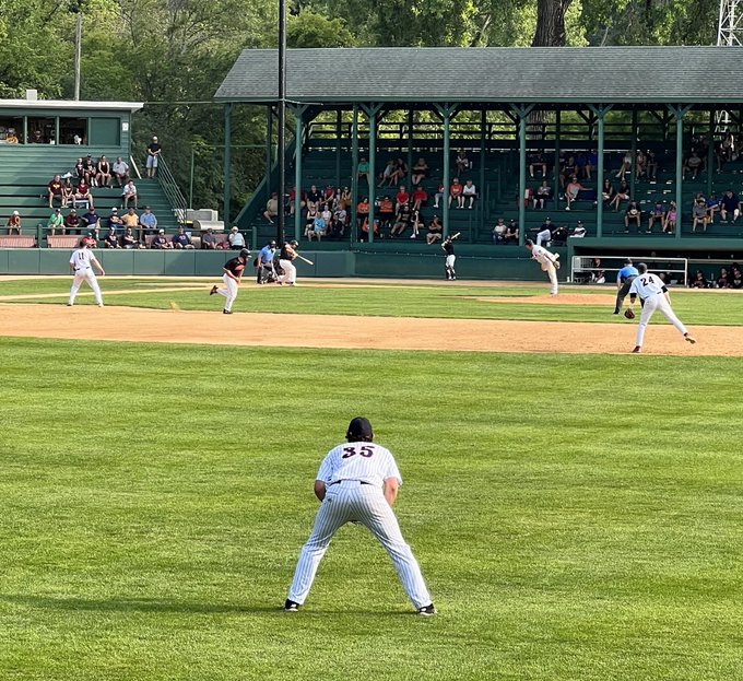 Brody Curtiss pitching, Derek Hoffman right field